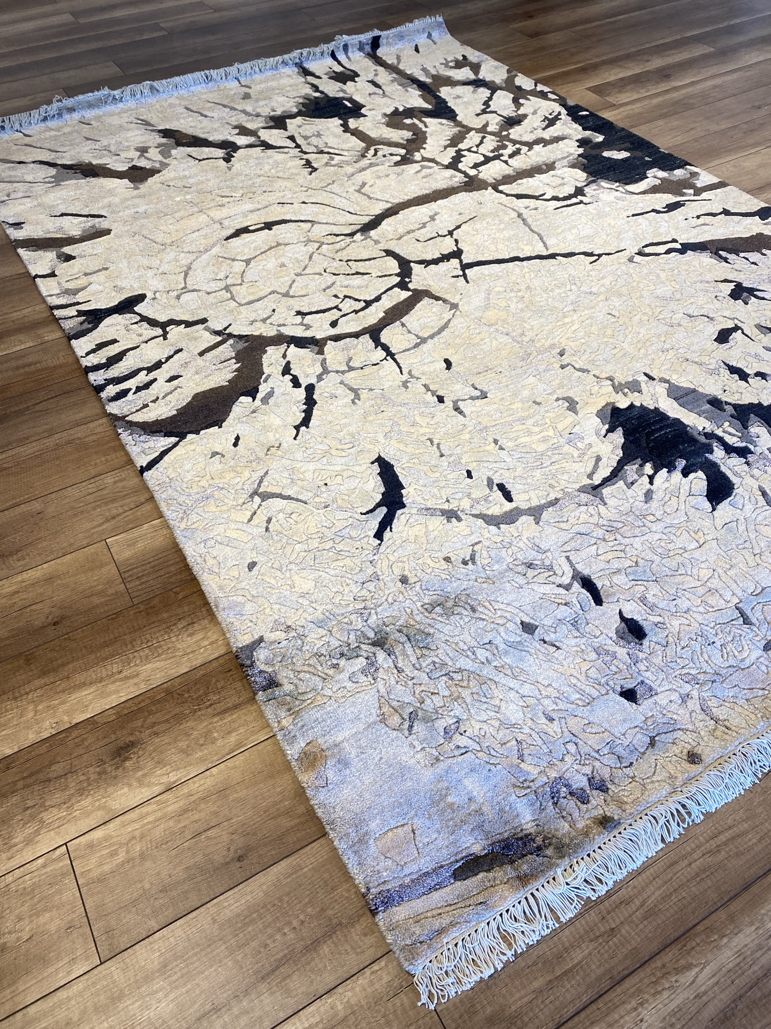 Modern Abstract Black/Ivory Branch — A distinguished modern abstract black/ivory branch featuring Dramatic tones and abstract design. Available in 5.10x8.10 ft. A statement piece for any space.