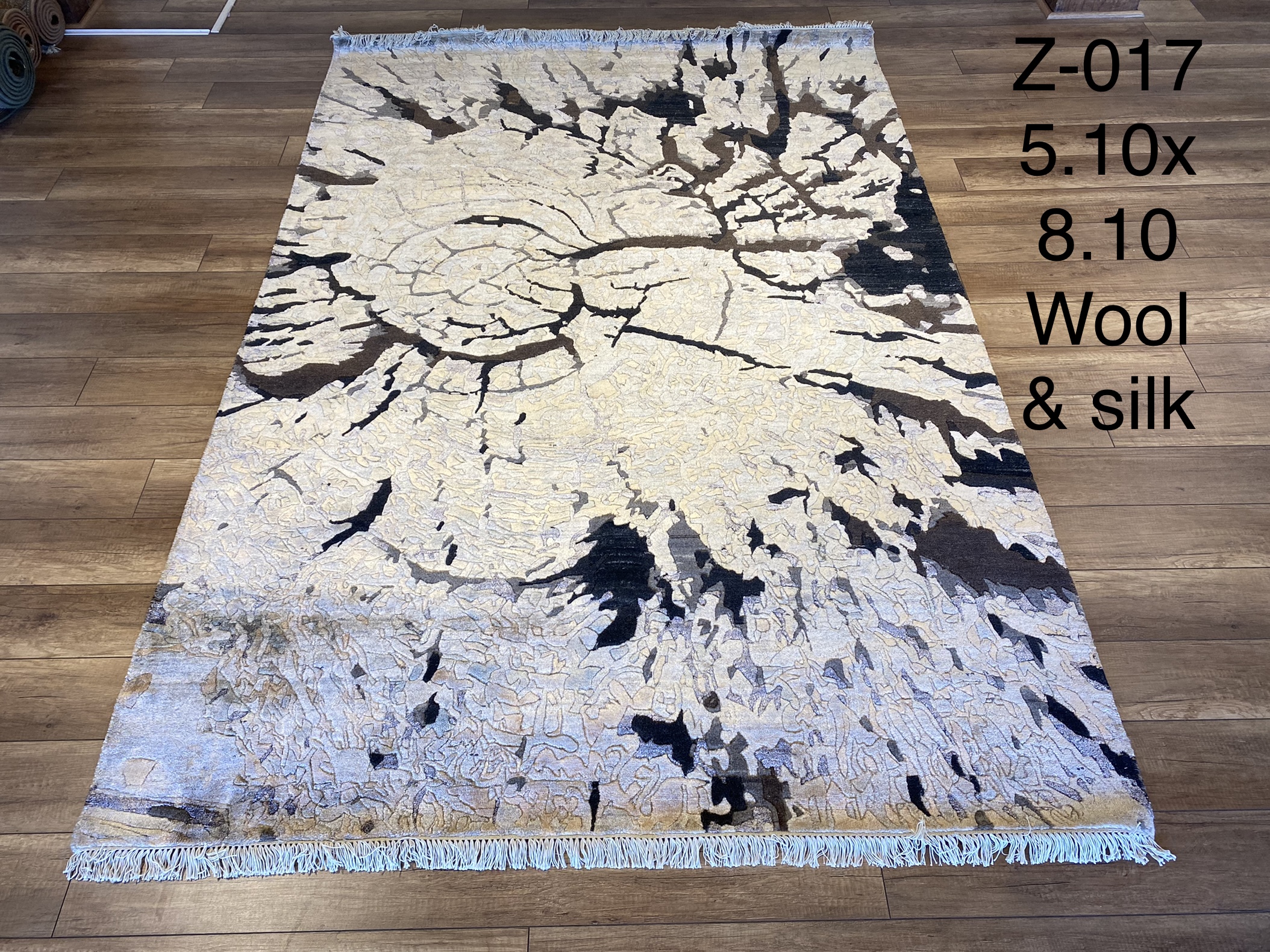 Z-017 Modern Abstract Black/Ivory — A distinguished z-017 modern abstract black/ivory featuring Dramatic tones and abstract design. Available in 5.10x8.10 ft. A statement piece for any space.